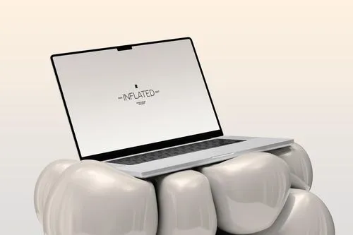 A laptop sitting on top of a group of teeth.